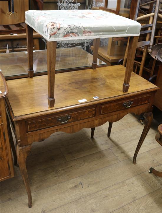A walnut writing table and a stool, W.105cm, stool W.56cm